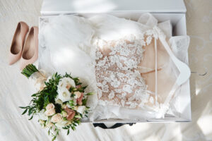 Wedding Dress, Bouquet and shoes all packed together in a white preservation box.