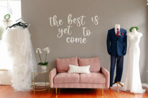 Weddings with Joy seating area decorated with wedding attire