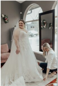 Plus-size, curvy Joyful Bride with her bridal stylist during her wedding dress appointment at Weddings with Joy.