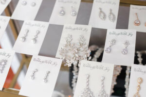 Weddings with Joy bridal accessories display case of diamond earrings