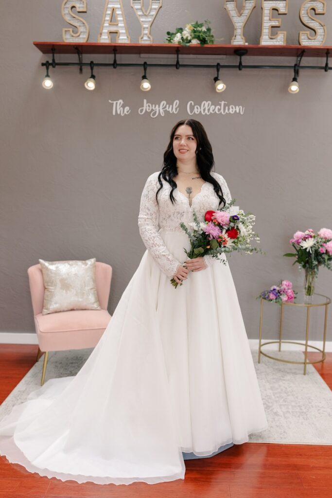 Long sleeves, lace bodice plus size wedding dress. Weddings with Joy. 