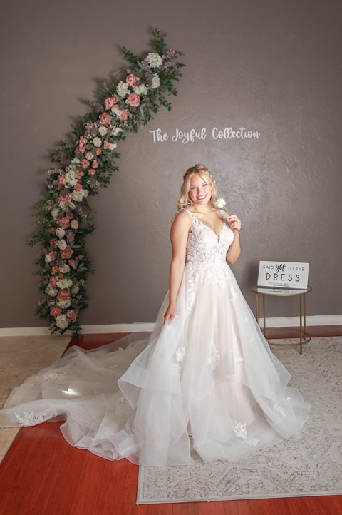 Tiered tulle skirt wedding dress with floral lace detailing. Weddings with Joy. 