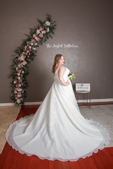 Modern minimalist plus size wedding dress, no lace, long train. Weddings with Joy. 