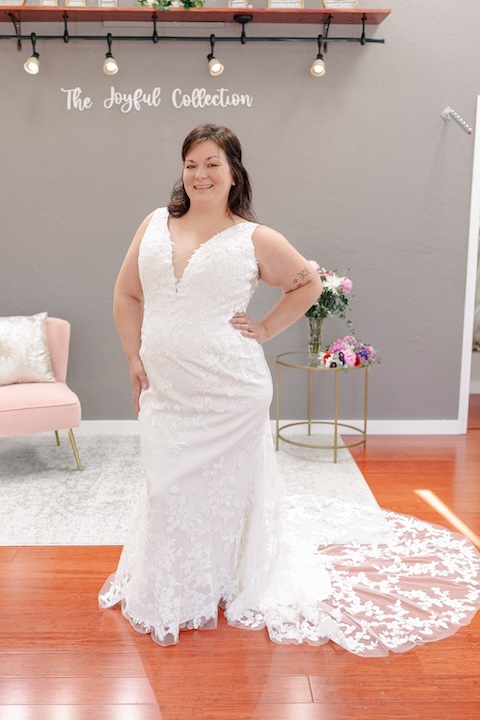 V neckline lace plus size wedding dress with straps. Weddings with Joy.