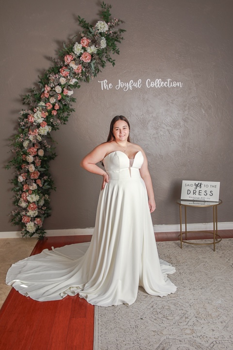 Strapless, minimalist plus size wedding dress. Weddings with Joy.