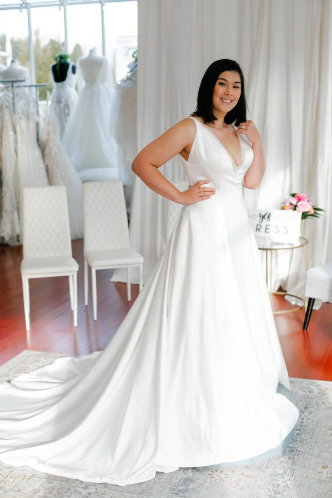 modern minimalist satin wedding dress with v-neckline and straps. Weddings with Joy.