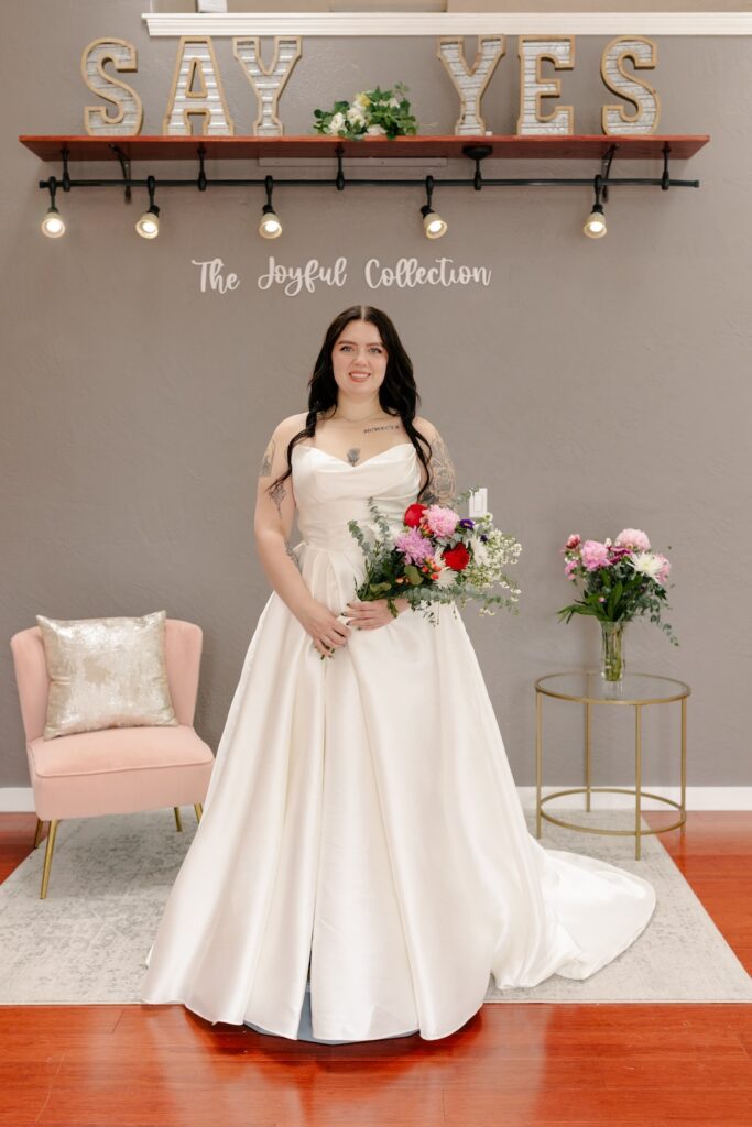 Ruched bodice minimalist wedding dress, strapless. Weddings with Joy.