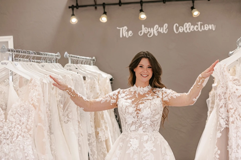 bride wearing lace long sleeves wedding dress, bridal shopping appointment in Olympia Washington. Weddings with Joy.