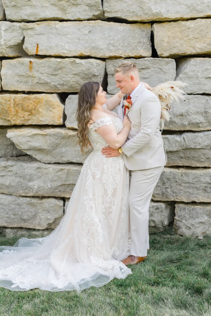 autumn wedding portrait, plus size lace wedding dress with off shoulders straps. dried floral bridal bouquet. Weddings with Joy.