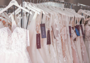 in store clothes rack of wedding dresses