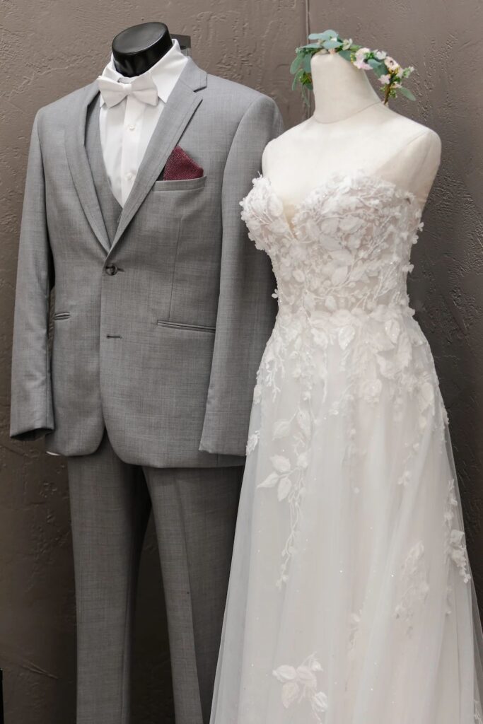 light grey suit with bow tie and burgundy pocket square. weddings with joy