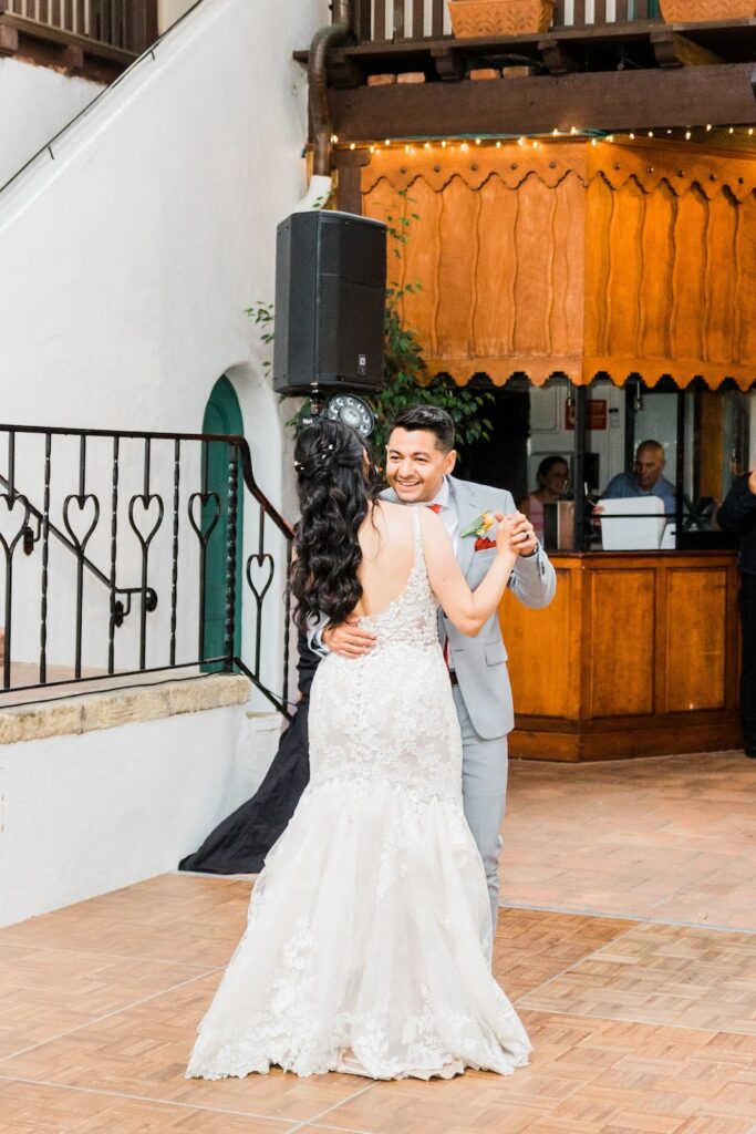 open back lace wedding dress with bustled dress train. wedding first dance. Weddings with Joy. 